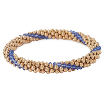 Load image into Gallery viewer, A photo of our 14KT Gold filled Beaded bracelets interlaced with Sapphire Swarvoski crystals.
