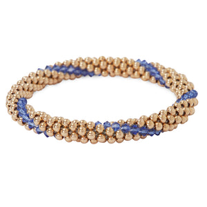 A photo of our 14KT Gold filled Beaded bracelets interlaced with Sapphire Swarvoski crystals.
