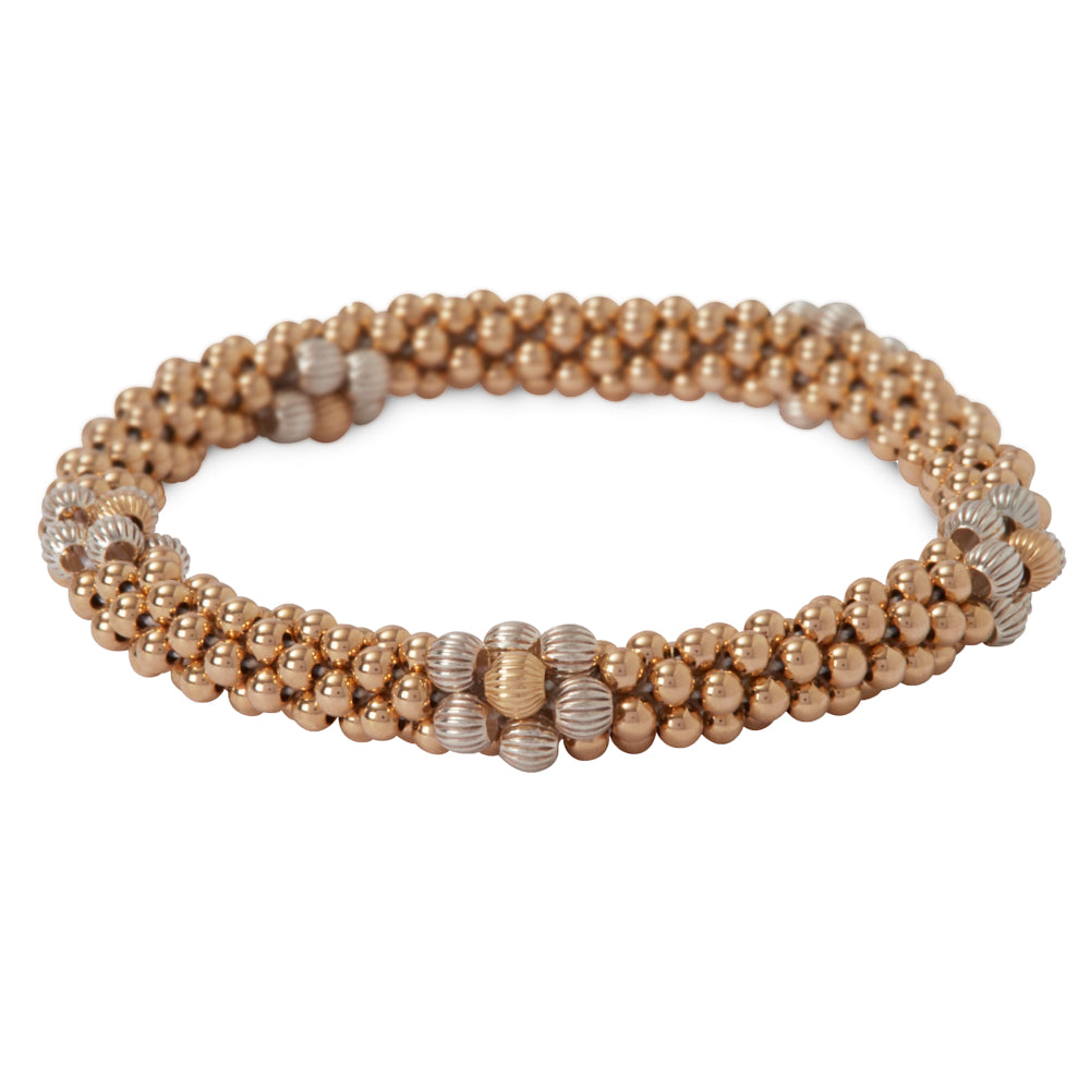 Beautiful 14 kt gold-filled bracelet with Sterling Silver flower design.
