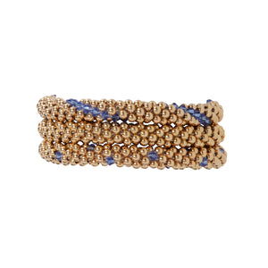 A photo of our very popular trio featuring our Classic Gold Bracelet, Gold with Sapphire Lines, an Gold with Sapphire Dots